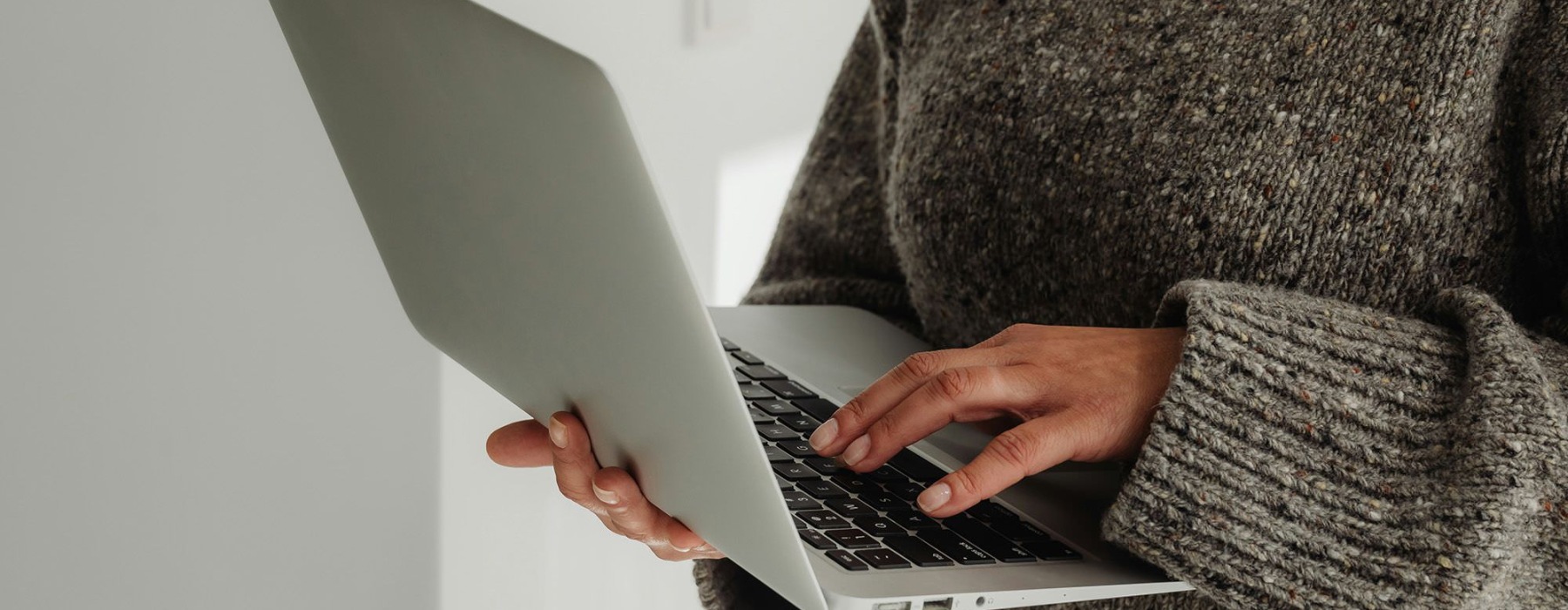 a person holding a laptop